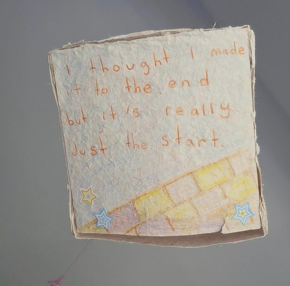 A paper lantern from Kiera’s project, “The Cutest Crashout in History.” The words read, “ur nvr truly tired when ur tired all the time,” with a drawing of a pencil, a to-do list, reminders, and a calendar.