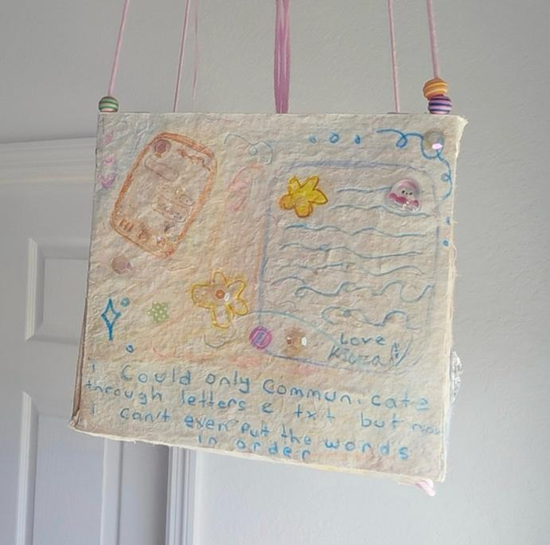 A paper lantern from Kiera’s project, “The Cutest Crashout in History.” The words read, “I could only communicate through letters & text but now I can’t even put the words in order.” The lantern includes drawings of text messages and a letter.