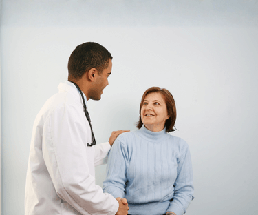 Doctor shaking Patient's Hand - Patient Sitting Down