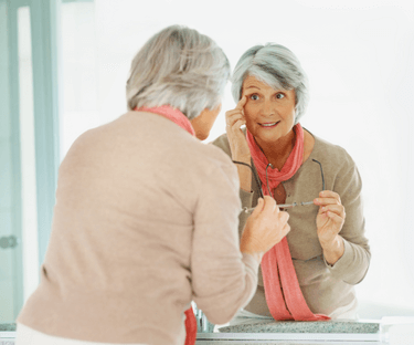 Woman Looking in Mirror
