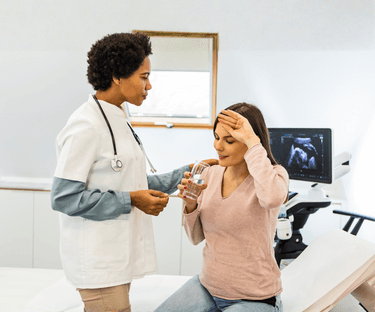 Woman with hand on face, faint, holding water