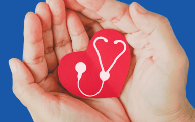 hands holding a heart with a stethoscope image within signifying heart health