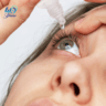 Woman adding eye drops to her eyes